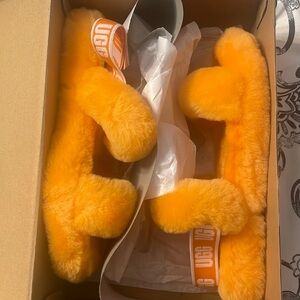 Uggs new slippers orange. Fits size 5-6 woman